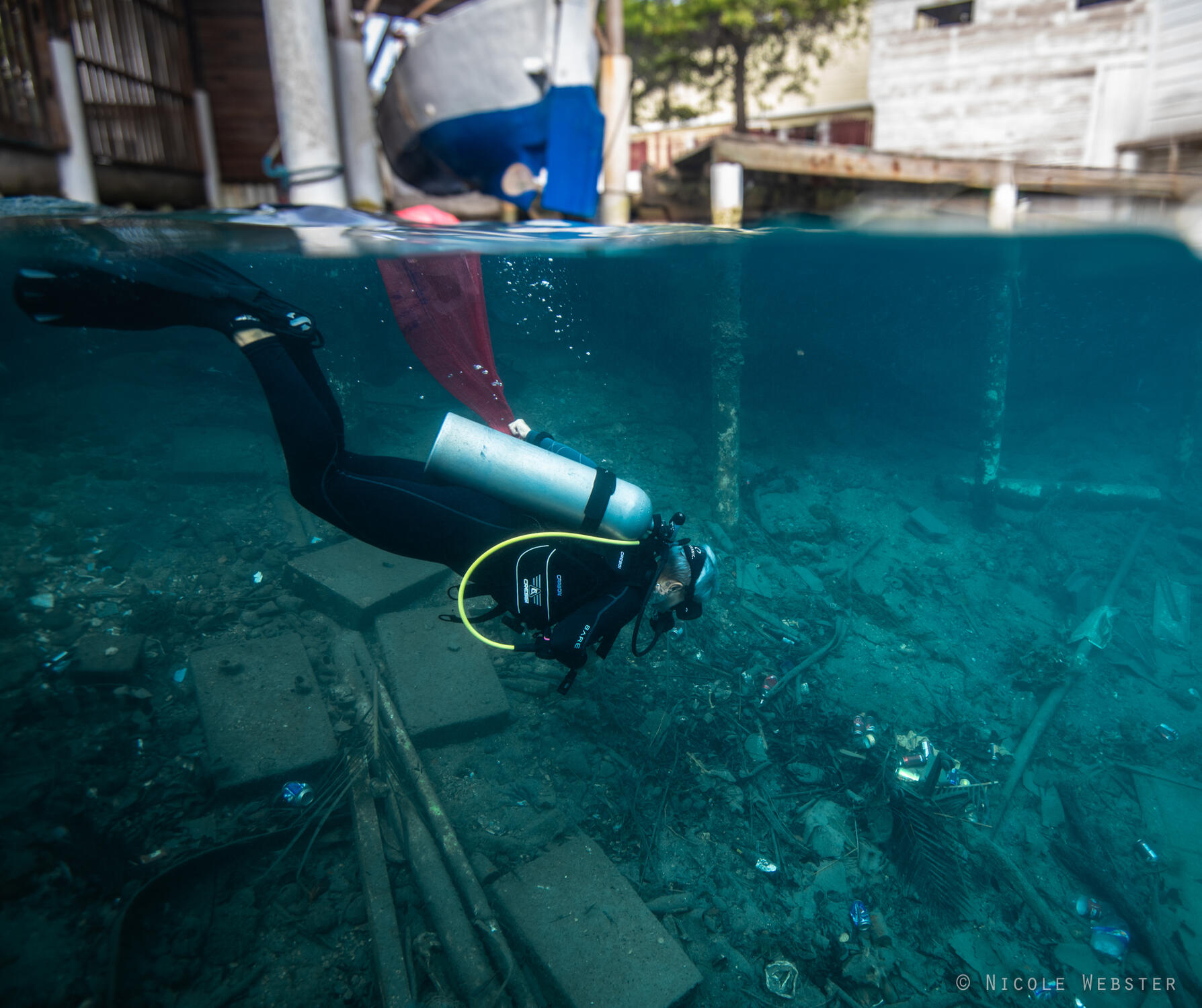 Mission Begins: As divers descend, they are met with a disheartening sight—a sea floor littered with plastic, discarded fishing gear, and debris.